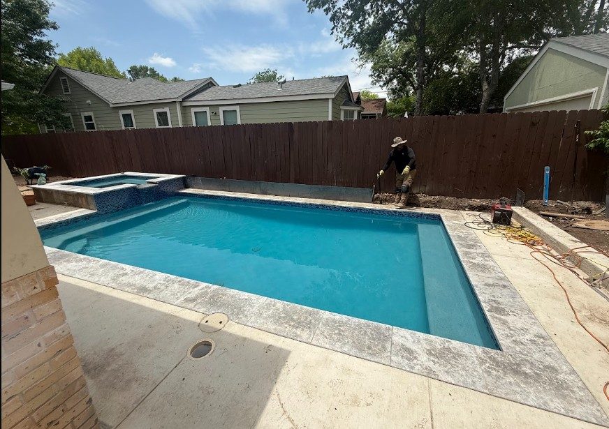 Custom pool with raised spa in Austin, TX by Renaissance Pools