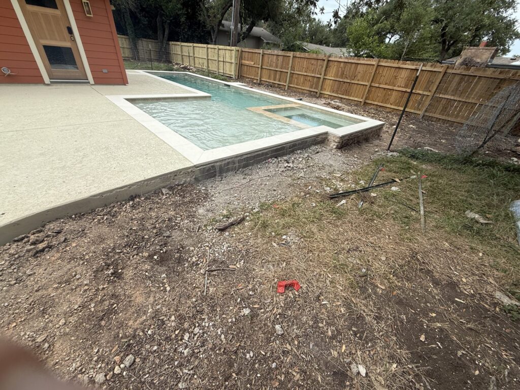 Custom pool with sunken spa in Austin, TX by Renaissance Pools