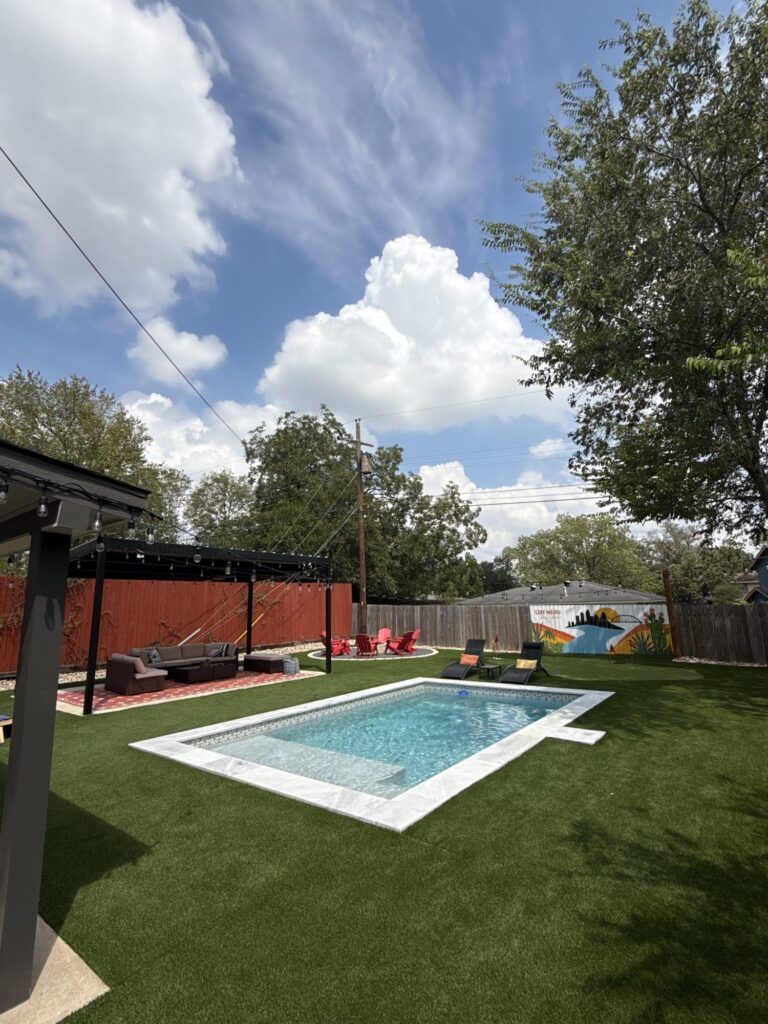 Custom pool with tanning ledge in Austin, TX by Renaissance Pools