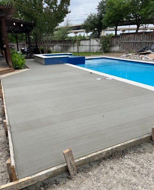 Pool, spa and new concrete decking in Round Rock, TX by Renaissance Pools