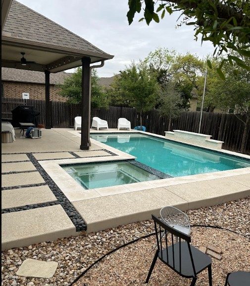 Pool with sunken spa and Baja ledge in Austin, TX by Renaissance Pools