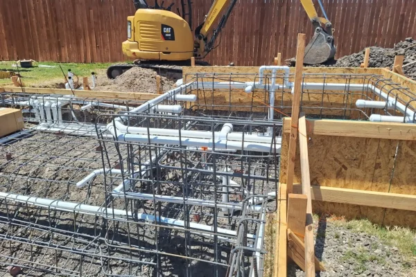 Steel rebar framing for a gunite pool and spa