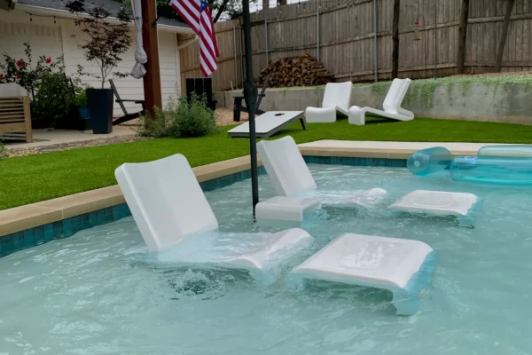 In-pool loungers on a tanning ledge